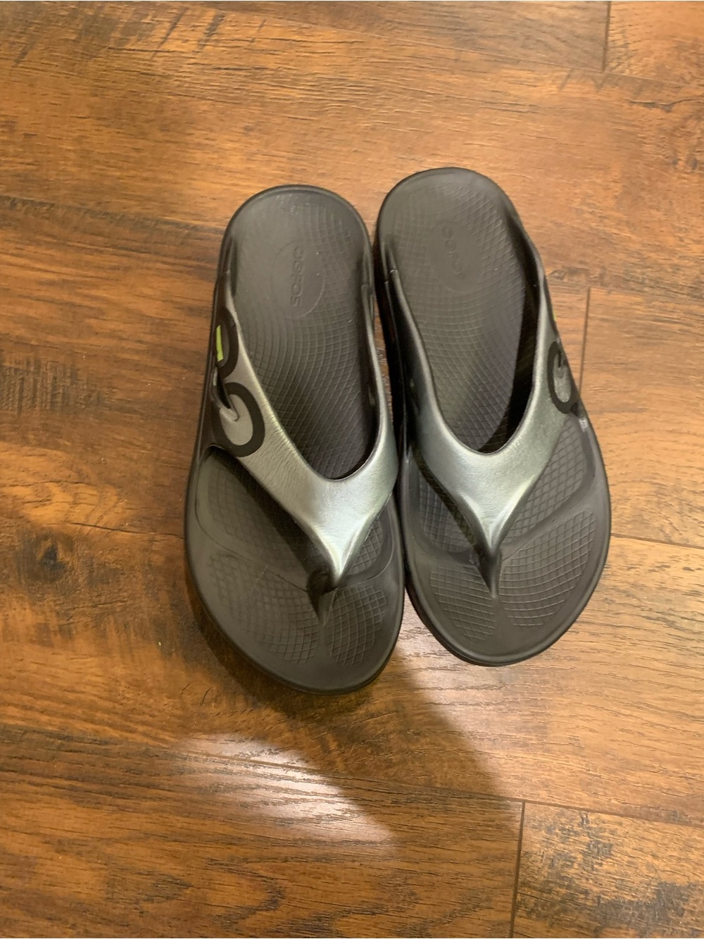 OOFOS Women's Black Flip Flop Sandals with Subtle Olive Accent